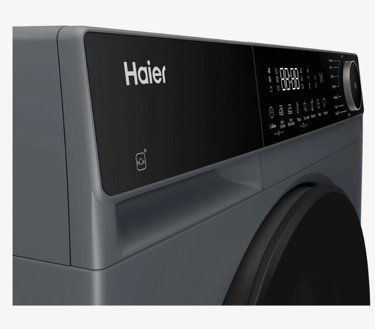 Close-up of a Haier Heat pump tumble dryer Graphite in colour showing the top control panel with a digital display and dial, set against a clean white background.