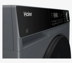 Close-up of a Haier Heat pump tumble dryer Graphite in colour showing the top control panel with a digital display and dial, set against a clean white background.